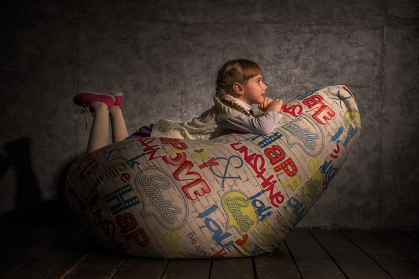 Girl Resting on Beanbag - Zdjęcie, obraz