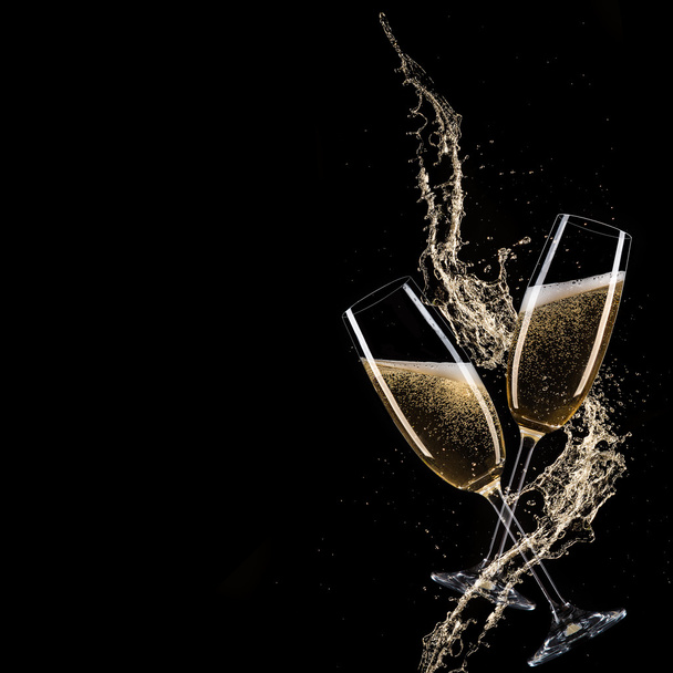 Glasses of champagne with splash - Photo, image