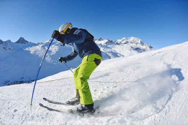 Skiing on fresh snow at winter season at beautiful sunny day - Foto, Imagem