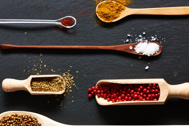 Spices in wooden utensils - Фото, зображення