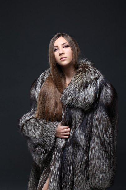 Portrait of a seductive lady in fur coat - 写真・画像