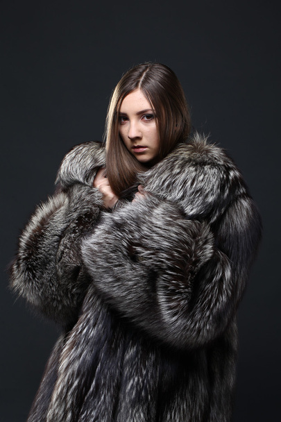 Portrait of a seductive lady in fur coat - Fotó, kép