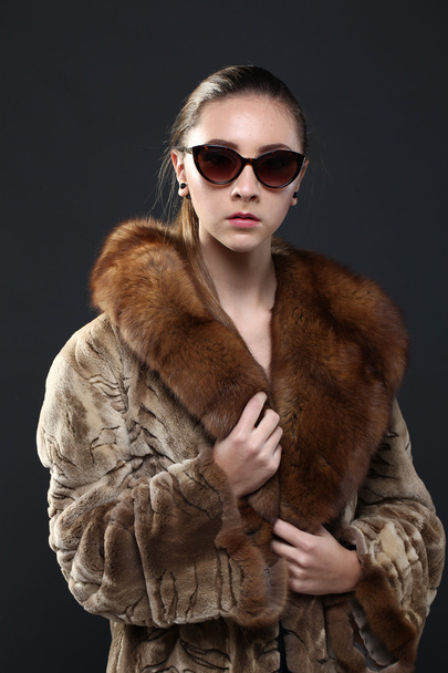 Portrait of a seductive lady in fur coat - Фото, изображение