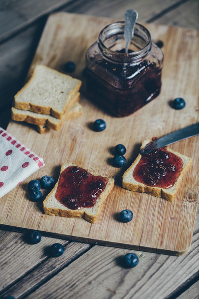 Toast bread with wild strawberry jam. Retro,vintage filter - Photo, Image