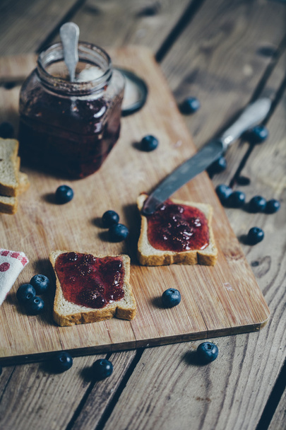 Toast bread with wild strawberry jam. Retro,vintage filter - Zdjęcie, obraz