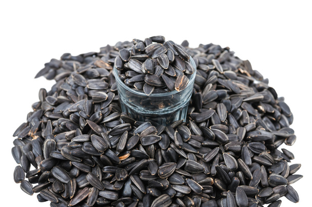 Sunflower seeds and faceted glass - Photo, Image