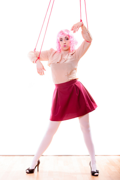 woman girl stylized like marionette puppet on string - Фото, изображение