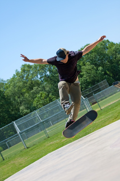 Skateboarder Doing Tricks On His Board - Фото, зображення