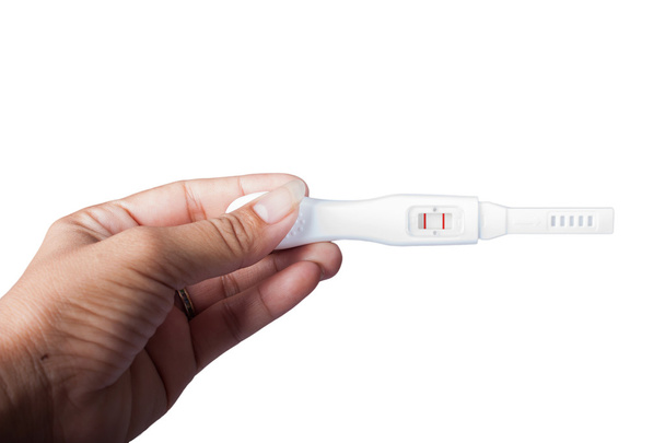 Hand women hold pregnancy test isolate  background - Photo, Image