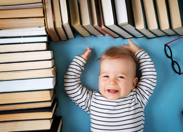 One year old baby with spectackles and books - Fotó, kép