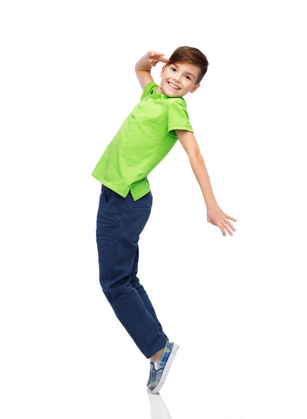smiling boy having fun or dancing - Foto, afbeelding