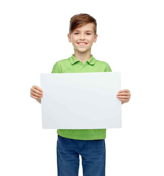happy boy in t-shirt holding white blank board - Φωτογραφία, εικόνα