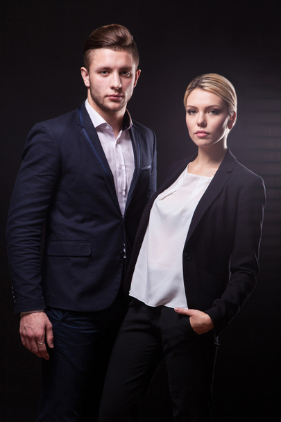 stylish, trendy and modern business man and woman on black backg - Photo, Image