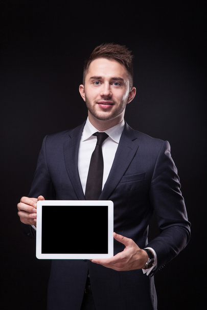 successful young businessman in a stylish business suit on a bla - Foto, Imagem