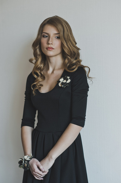 Studio portrait of a girl in a black dress 4463. - Foto, imagen