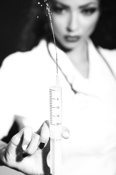 Nurse holding suringe - Photo, image