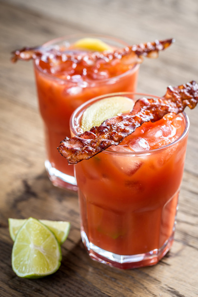 Two glasses of Bloody Mary with bacon rashers - Foto, immagini
