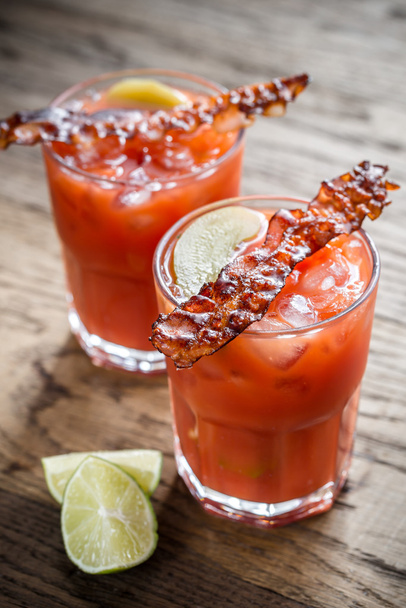Two glasses of Bloody Mary with bacon rashers - Photo, Image