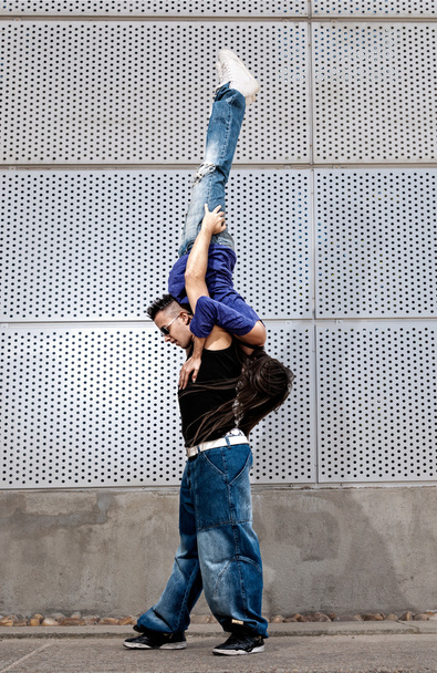 Young urban couple dancers hip hop dancing urban scene - Photo, Image