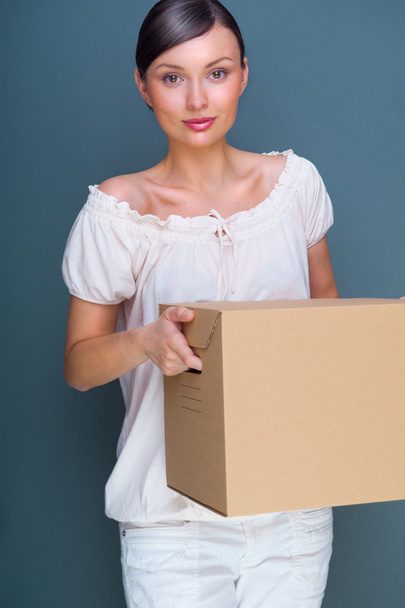 Close-up portrait of a young woman with box - Фото, изображение