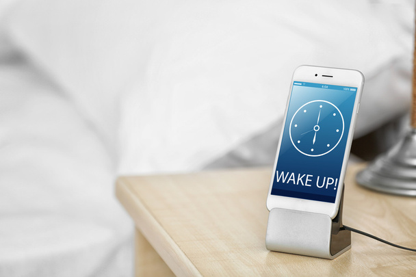 Smart phone on nightstand - Foto, imagen