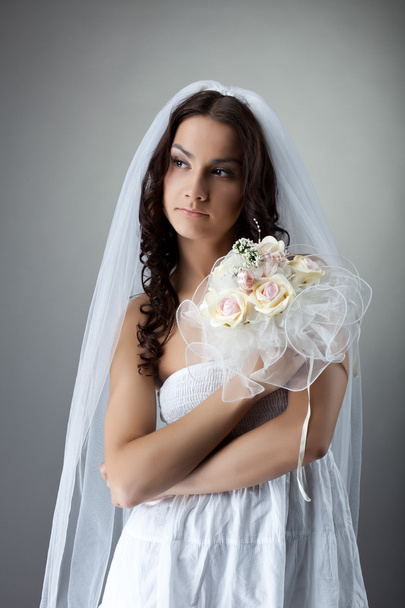 Beauty young bride portrait with bunch of flowers - Photo, image