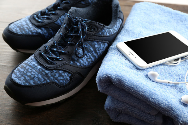 Sport shoes, towel and smart phone - Φωτογραφία, εικόνα