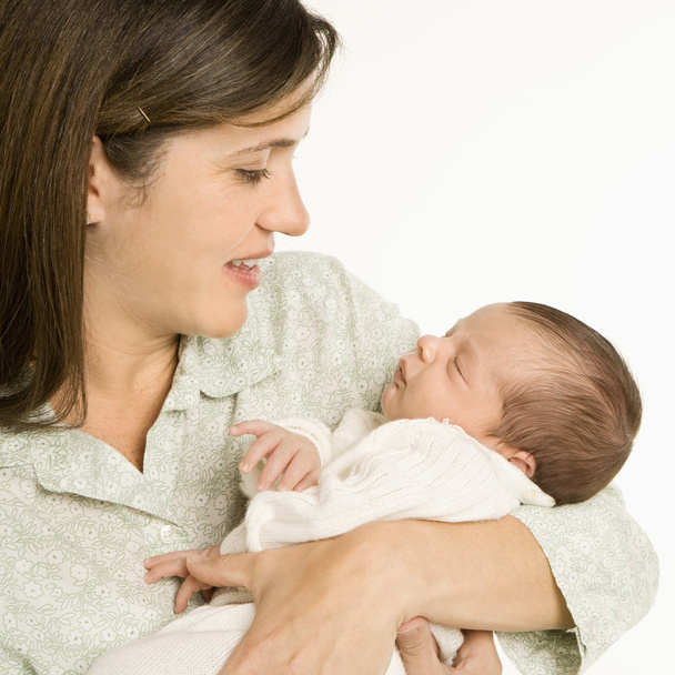 Smiling mother holding baby. - Valokuva, kuva