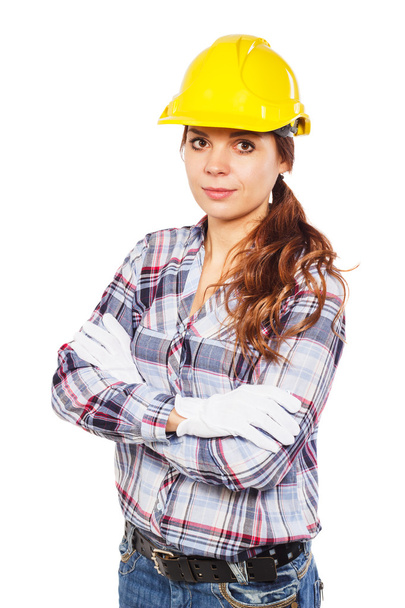 Jovem mulher em capacete de construção amarelo
  - Foto, Imagem