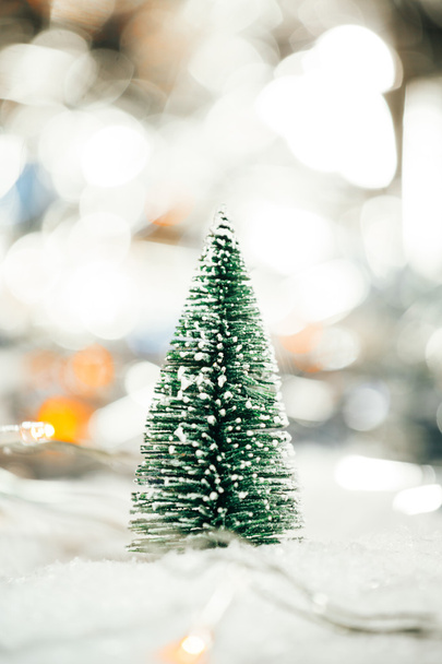 miniature Christmas tree in the snow and decorations - Φωτογραφία, εικόνα