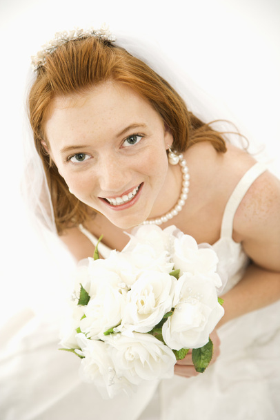 Bride holding bouquet. - 写真・画像