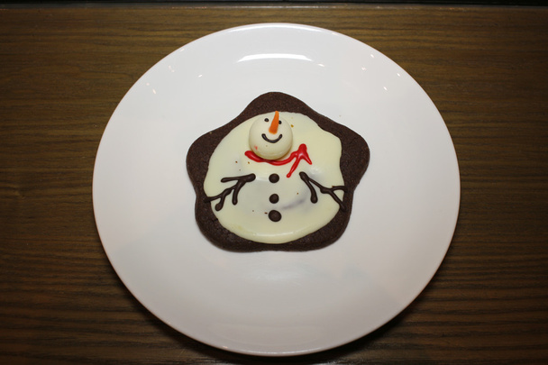 un bonhomme de neige en pain d'épice
 - Photo, image