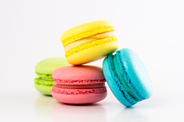 Collection of brightly colored French macarons on white background - Foto, imagen