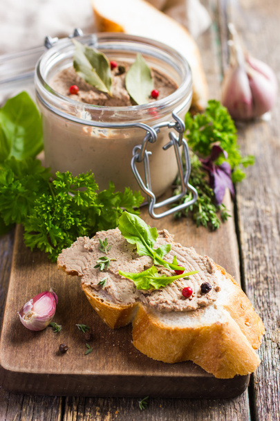 bread with chicken liver pate on wooden cutting board - Photo, image