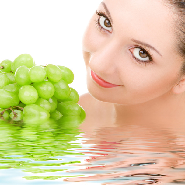 Pretty woman with green grape isolated on the white background - Fotoğraf, Görsel