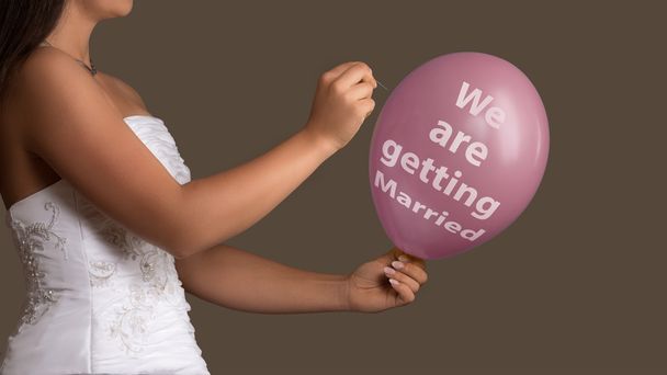  Bride lets a Balloon with Text burst with a needle - Photo, Image