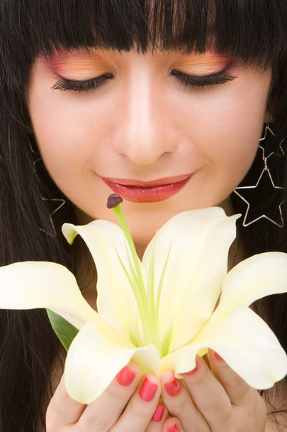 Young woman with lily flower - Foto, immagini
