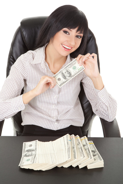 Elegant business woman with pile of money - Photo, image