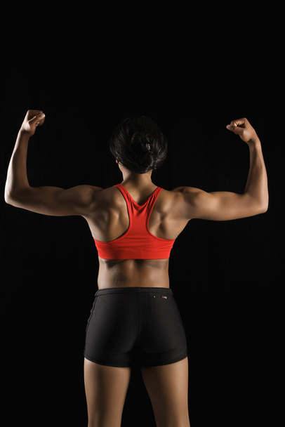 Back of muscular woman. - Φωτογραφία, εικόνα