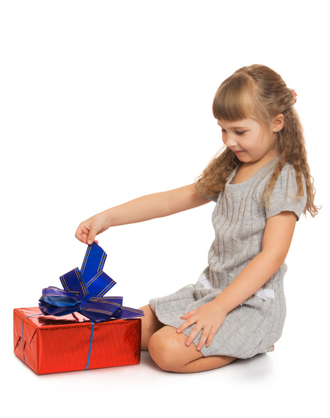little girl with a gift - Zdjęcie, obraz