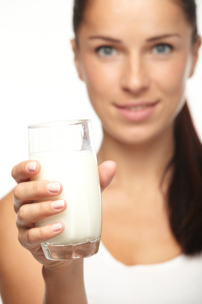 Young woman with glass of milk - Фото, зображення