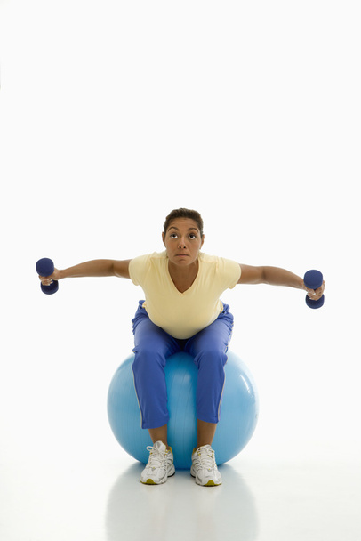 Woman exercising on ball. - Foto, Imagen