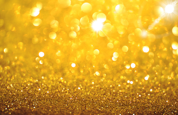 Yellow golden glittering Christmas lights. Blurred abstract back - Photo, Image