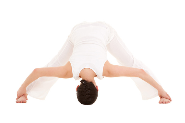 Young woman doing yoga exercise - Photo, Image