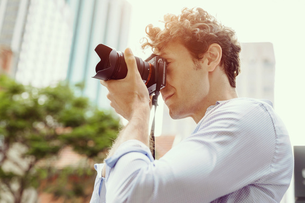 Male photographer taking picture - Фото, зображення