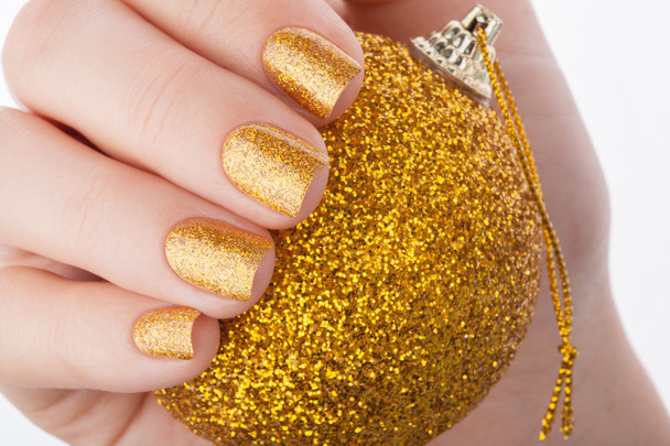 Beautiful golden manicure. - Photo, Image