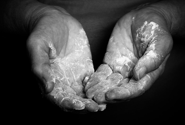 Flour in the womans hand. Selective focus. Toned - Foto, Imagem