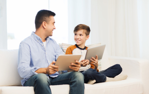 happy father and son with tablet pc at home - Zdjęcie, obraz