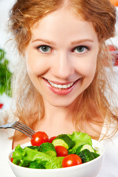 woman eats healthy food vegetable vegetarian salad about refrige - Photo, Image