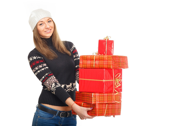 Woman in a winter sweater holding boxes with gifts. - Photo, Image